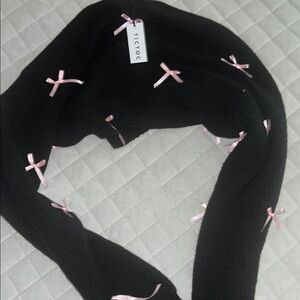 Black shrug with bows